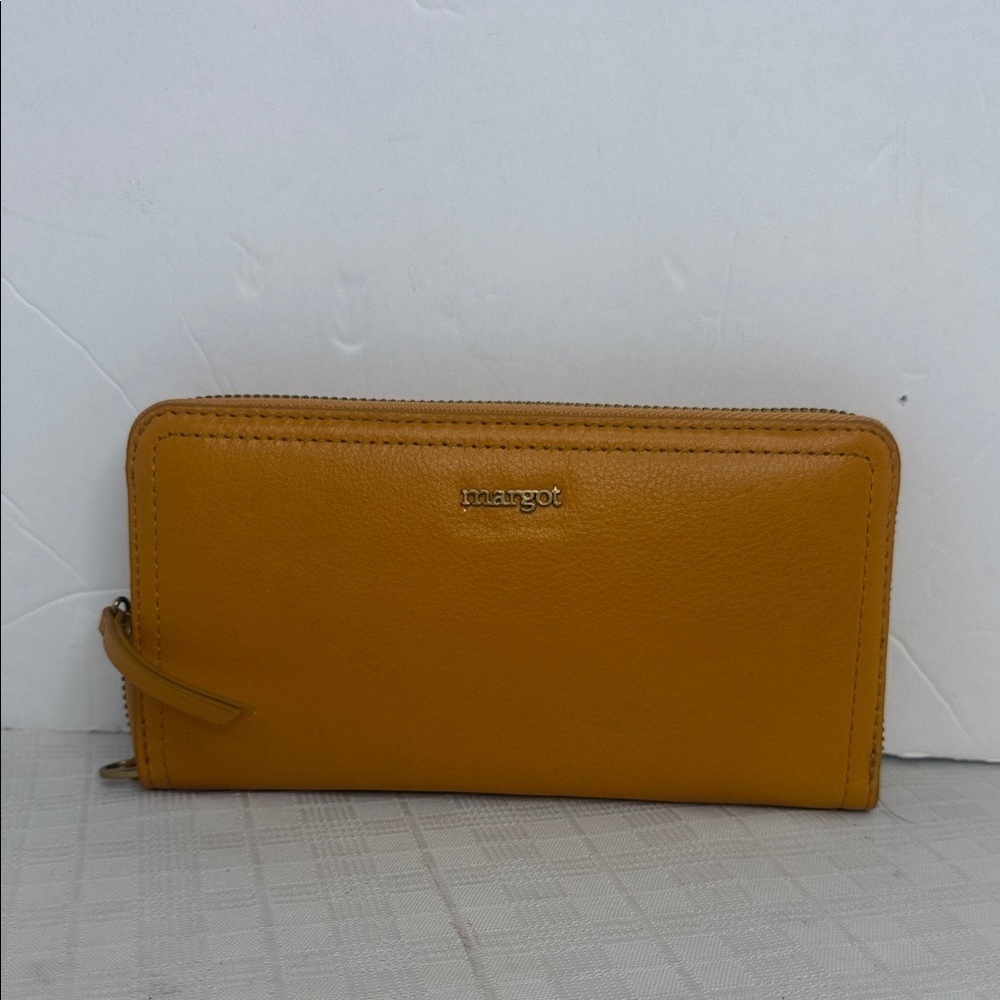 Margot Anna Zip Around Leather Wallet in marigold yellow.